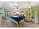 Spacious main bedroom with lake views, ceiling fan, and comfortable furniture at 812 Bell Post Rd, Belmont, NC 28012