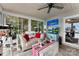 Sunroom showcasing comfortable seating, lake views, and ample natural light at 812 Bell Post Rd, Belmont, NC 28012
