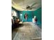 Bedroom with teal walls and ceiling fan at 850 And 830 E Nc 152 E Hwy, China Grove, NC 28023