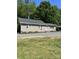 Newly renovated home with classic siding and a well-maintained yard, perfect for comfortable living and outdoor enjoyment at 850 And 830 E Nc 152 E Hwy, China Grove, NC 28023