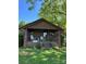 Cozy front porch with rocking chairs, inviting guests to relax and enjoy the peaceful surroundings of this charming bungalow at 850 And 830 E Nc 152 E Hwy, China Grove, NC 28023