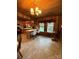 Bright kitchen with wood-paneled walls, tile flooring, breakfast bar, and abundant natural light at 850 And 830 E Nc 152 E Hwy, China Grove, NC 28023