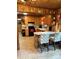 Eat-in kitchen with tile floor, wooden cabinets, black appliances, and a breakfast bar at 850 And 830 E Nc 152 E Hwy, China Grove, NC 28023