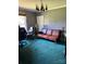 Living room with a wooden couch and teal carpet at 850 And 830 E Nc 152 E Hwy, China Grove, NC 28023
