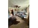 Open living room featuring a large grey sectional sofa and hide rug at 850 And 830 E Nc 152 E Hwy, China Grove, NC 28023