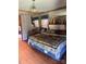 Main bedroom with hardwood flooring and wood-paneled walls for a cozy ambiance at 850 And 830 E Nc 152 E Hwy, China Grove, NC 28023