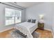 Cozy bedroom with natural light and wood floors, perfect for relaxation and comfort at 8608 Talbert Paige Ct, Charlotte, NC 28277