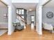 Inviting foyer with hardwood floors, elegant columns, and a staircase at 8608 Talbert Paige Ct, Charlotte, NC 28277