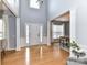 Spacious foyer featuring a tall ceiling, hardwood floors, and natural light at 8608 Talbert Paige Ct, Charlotte, NC 28277