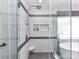 Modern bathroom shower with built-in seat, and a soaking tub at 8608 Talbert Paige Ct, Charlotte, NC 28277