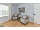 Cozy sitting area with chairs, neutral tones, and natural light. Modern wall art at 8608 Talbert Paige Ct, Charlotte, NC 28277