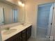 Bathroom with double sink vanity and a view into the shower/tub at 9108 Dulwich Dr # Ken0074, Charlotte, NC 28215