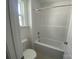 Bright bathroom featuring a shower and tub combo with a white shower curtain at 9108 Dulwich Dr # Ken0074, Charlotte, NC 28215