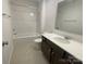Bathroom features modern vanity and a shower and tub combo at 9108 Dulwich Dr # Ken0074, Charlotte, NC 28215