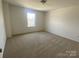 Spacious bedroom features a window for natural light at 9108 Dulwich Dr # Ken0074, Charlotte, NC 28215