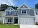 Charming two-story home with a well-manicured lawn, inviting entrance, and attached two-car garage at 9108 Dulwich Dr # Ken0074, Charlotte, NC 28215
