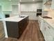 Kitchen boasting a large island with stone countertop, stainless steel appliances, and custom cabinetry at 9108 Dulwich Dr # Ken0074, Charlotte, NC 28215