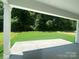 Covered patio with concrete flooring overlooking a lush green backyard, perfect for outdoor relaxation at 9108 Dulwich Dr # Ken0074, Charlotte, NC 28215