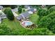 Backyard oasis with a sparkling pool, lounge chairs, a covered deck, and a well-maintained landscaped yard at 1028 Pocono Pl, Newton, NC 28658