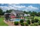 A sprawling backyard with a large inground pool, a deck, a gazebo, and lush green grass at 1028 Pocono Pl, Newton, NC 28658