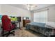 Relaxing bedroom with neutral carpet, a ceiling fan, and plenty of natural light at 1028 Pocono Pl, Newton, NC 28658