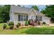 Charming one-story home with manicured lawn, updated landscaping, and a welcoming front porch at 1028 Pocono Pl, Newton, NC 28658