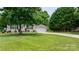 Charming single-story home with a well-manicured lawn, lush landscaping, and an attached two-car garage at 1028 Pocono Pl, Newton, NC 28658