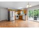 Kitchen features matching appliances, wood cabinets and sliding glass door leading to the back deck at 1028 Pocono Pl, Newton, NC 28658
