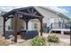 Inviting outdoor patio with pergola, fire pit, and comfortable seating at 1028 Pocono Pl, Newton, NC 28658