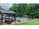 A stunning fenced in inground pool and a seating area under a gazebo, perfect for outdoor relaxation and entertainment at 1028 Pocono Pl, Newton, NC 28658