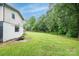 Expansive backyard with lush green grass and mature trees at 1036 20Th Ne St, Hickory, NC 28601