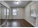 Bright bedroom featuring hardwood floors, natural light, and a mirrored sliding door closet at 1036 20Th Ne St, Hickory, NC 28601