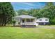 Inviting exterior view of home with a well-maintained lawn and covered front porch at 1036 20Th Ne St, Hickory, NC 28601