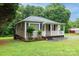 Exterior view of charming home with small garden and a cozy covered porch at 1036 20Th Ne St, Hickory, NC 28601
