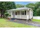 Charming single-story home featuring a cozy front porch and landscaped garden at 1036 20Th Ne St, Hickory, NC 28601