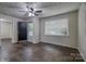Living room with hardwood floors and natural light streaming through large windows at 1036 20Th Ne St, Hickory, NC 28601