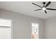 Bedroom with modern ceiling fan, neutral walls and attached bathroom at 11139 Tradition View Dr, Charlotte, NC 28269