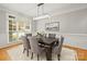 Dining room featuring a modern chandelier, large windows, and seating for six at 11139 Tradition View Dr, Charlotte, NC 28269