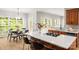 Bright kitchen with a kitchen island with seating, stainless steel appliances, and a breakfast nook at 11139 Tradition View Dr, Charlotte, NC 28269