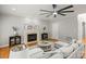 Spacious living room featuring a fireplace, ceiling fan, and neutral tones for a bright, airy feel at 11139 Tradition View Dr, Charlotte, NC 28269
