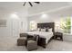 Main bedroom showcasing a large bed, sitting area, and bright, airy ambiance with natural light at 11139 Tradition View Dr, Charlotte, NC 28269