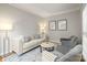 Cozy sitting room with neutral tones, comfortable seating, and natural light from the window at 11139 Tradition View Dr, Charlotte, NC 28269