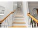 Staircase with light wood treads, white risers, and white railing at 11139 Tradition View Dr, Charlotte, NC 28269