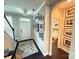Inviting entryway featuring a staircase, dark wood floors, and neutral wall color with art at 114 Mint Ave # A, Mooresville, NC 28117