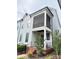 Exterior view of a townhome featuring a screened porch, front entrance, and landscaping at 114 Mint Ave # A, Mooresville, NC 28117