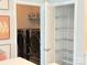 Well-lit laundry room and shelving space with neutral walls and storage at 114 Mint Ave # A, Mooresville, NC 28117