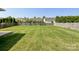 Spacious and well-kept backyard with a wooden fence, offering a private and serene outdoor space at 1228 Tranquil Falls Ln, Matthews, NC 28104