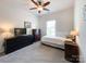 Bedroom with carpet, ceiling fan, a large window, and furnished with a TV and dressers at 1228 Tranquil Falls Ln, Matthews, NC 28104