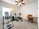 Spacious bedroom with a weightlifting gym and carpet at 1228 Tranquil Falls Ln, Matthews, NC 28104