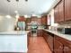 Spacious kitchen with stainless steel appliances, granite countertops, and dark wood cabinets at 1228 Tranquil Falls Ln, Matthews, NC 28104